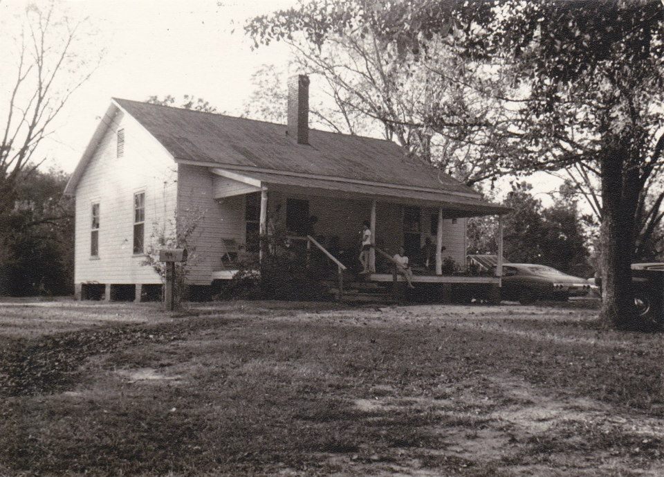 Old photo of a farmhouse in the country